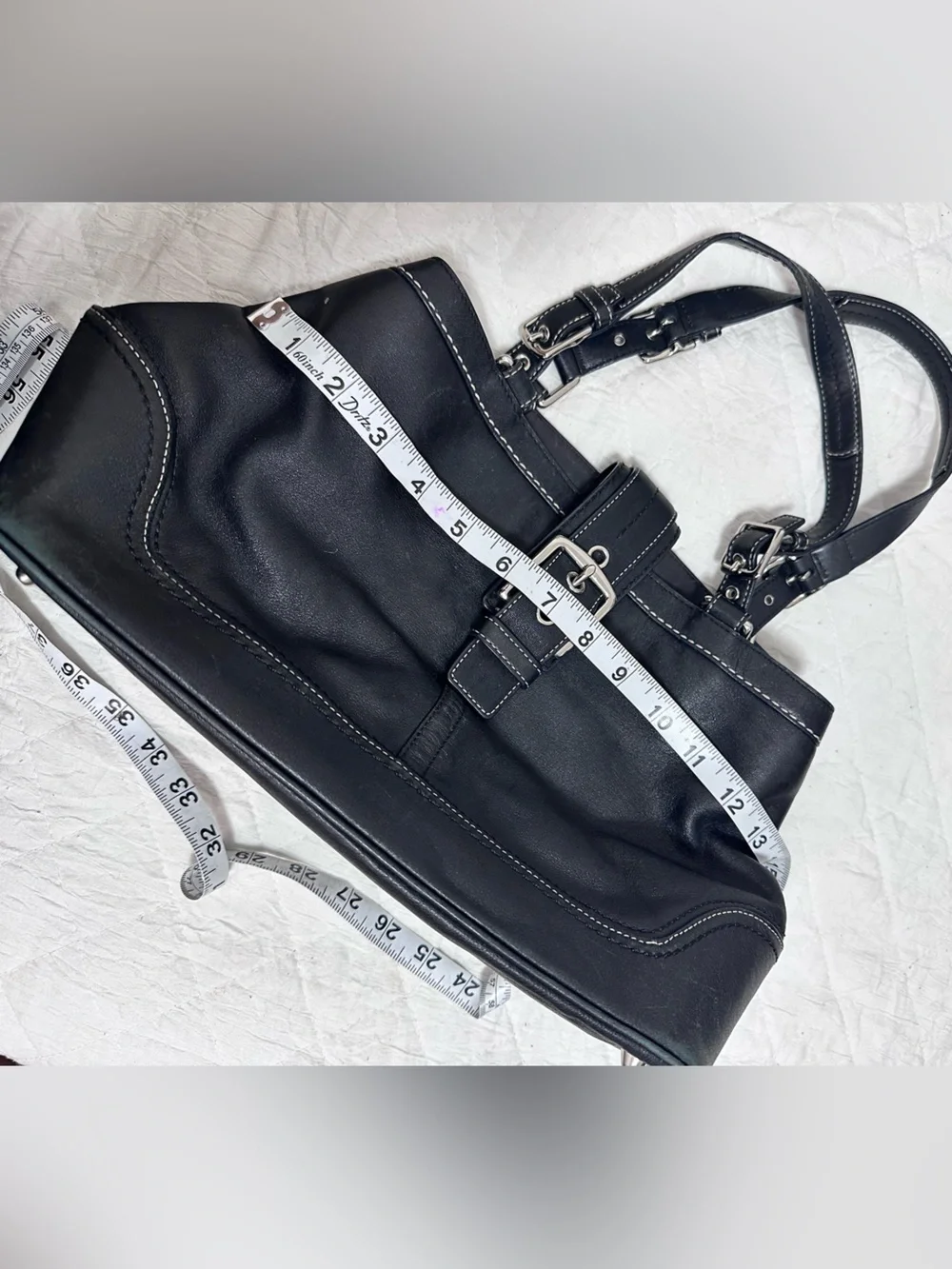 Coach stitching handles adds